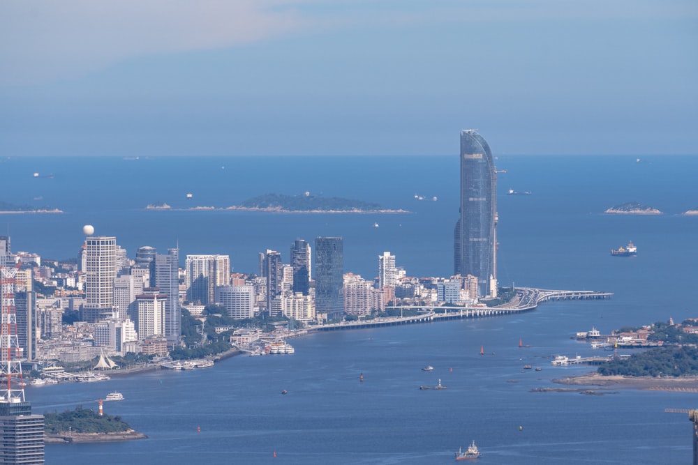 a large body of water with a city in the background