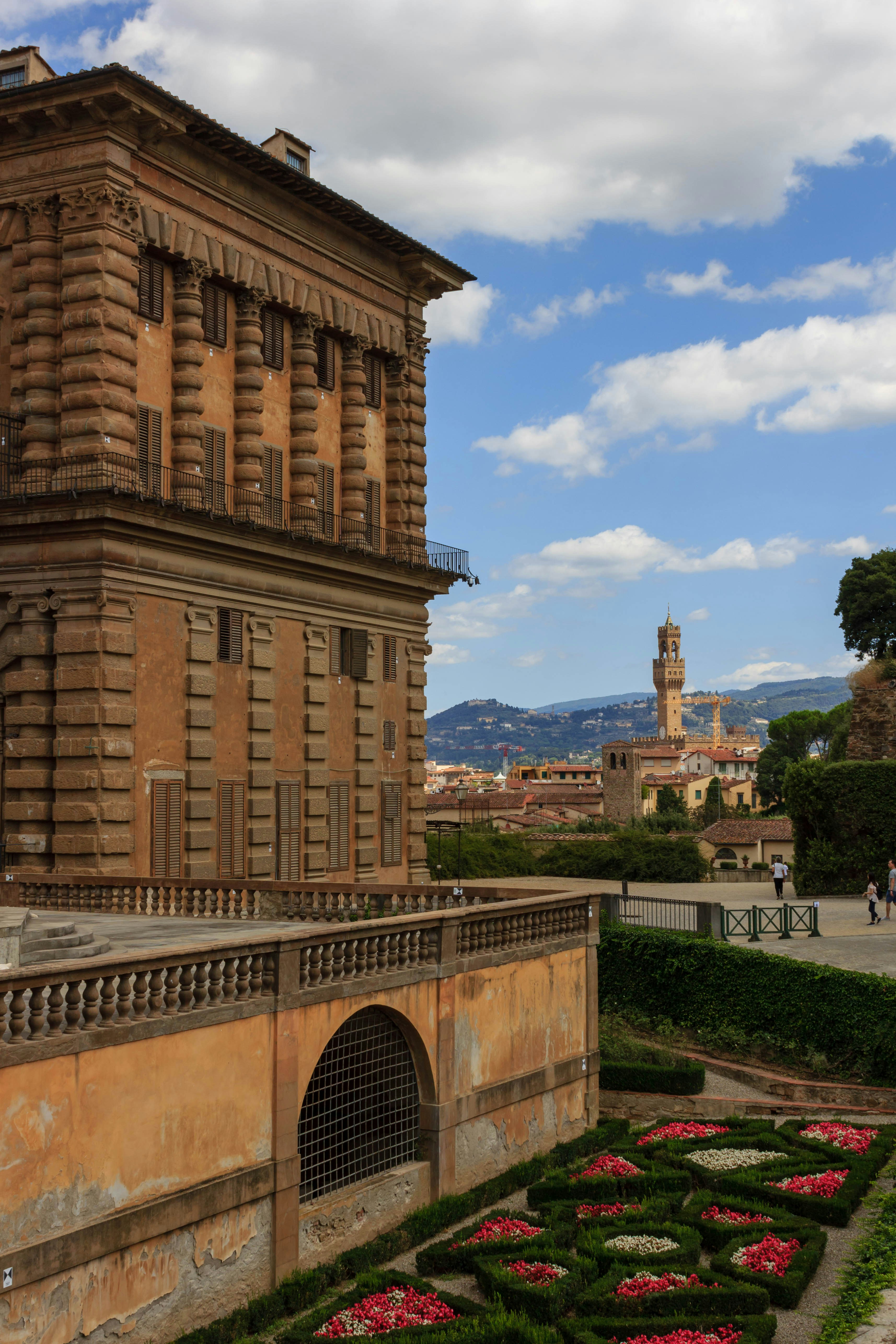 a very tall building with a clock tower in the background