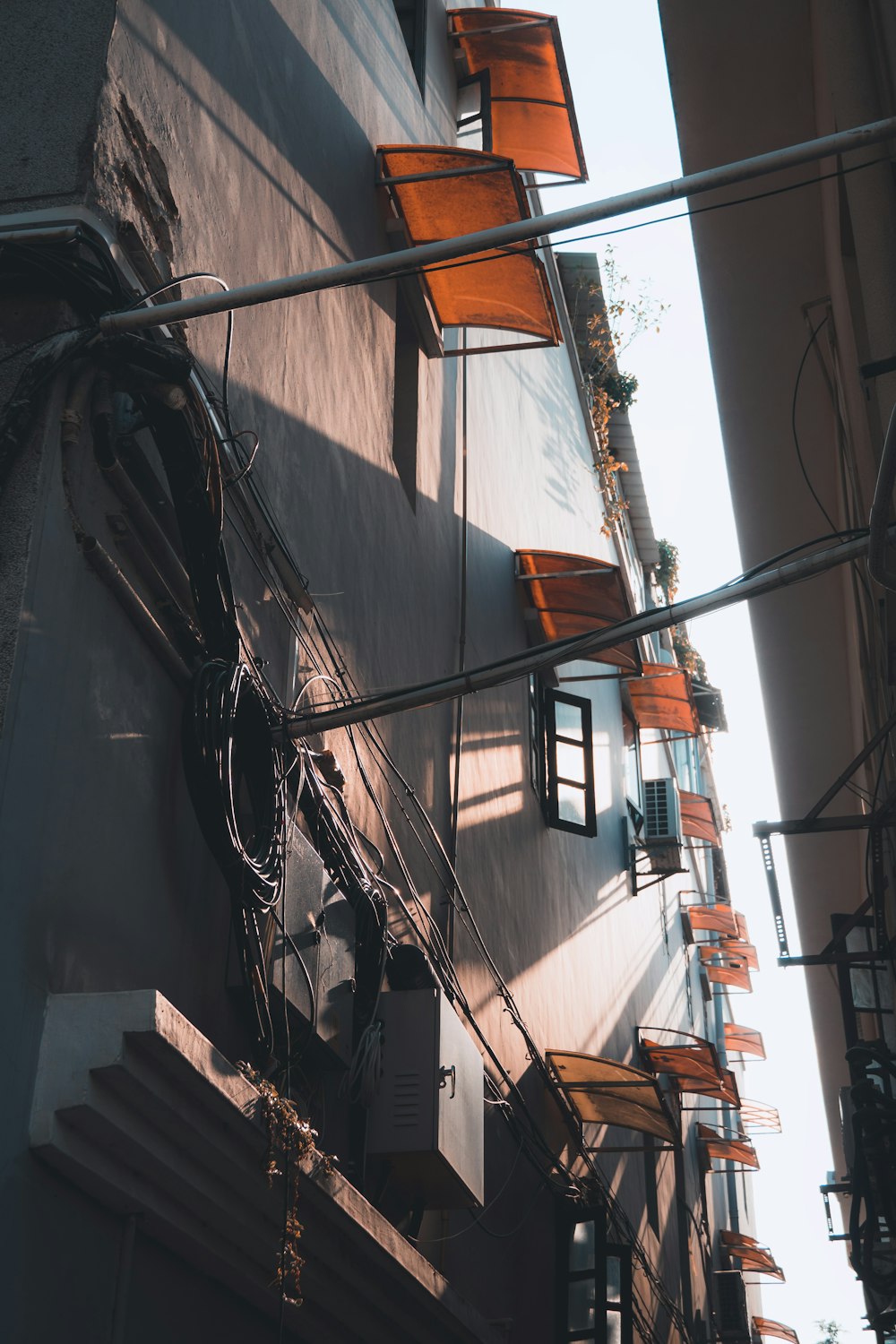 a building with a bunch of chairs hanging off the side of it