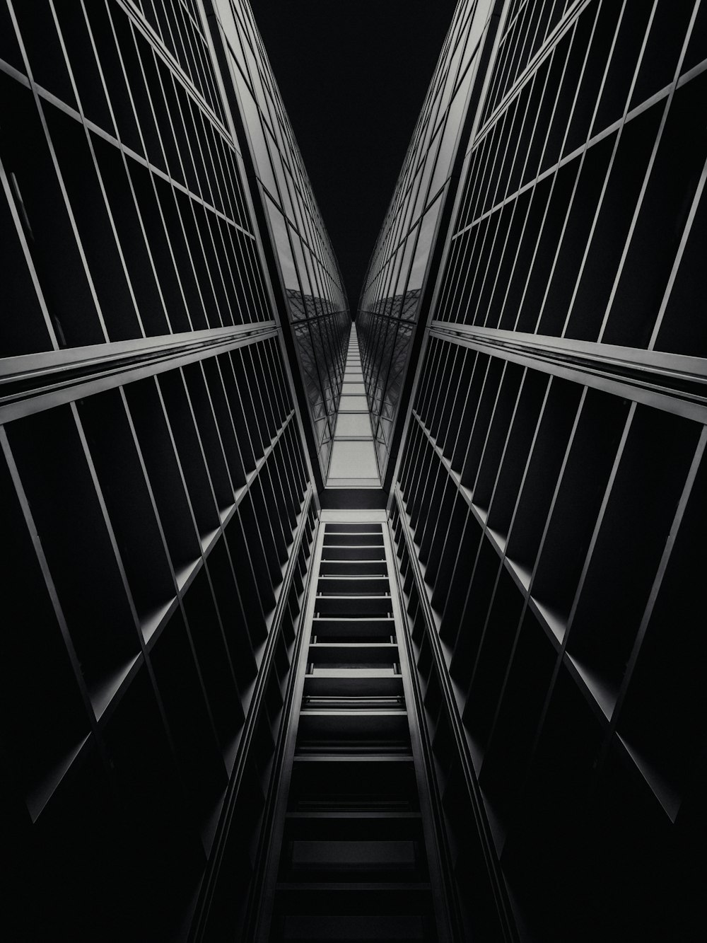 a black and white photo of a set of stairs