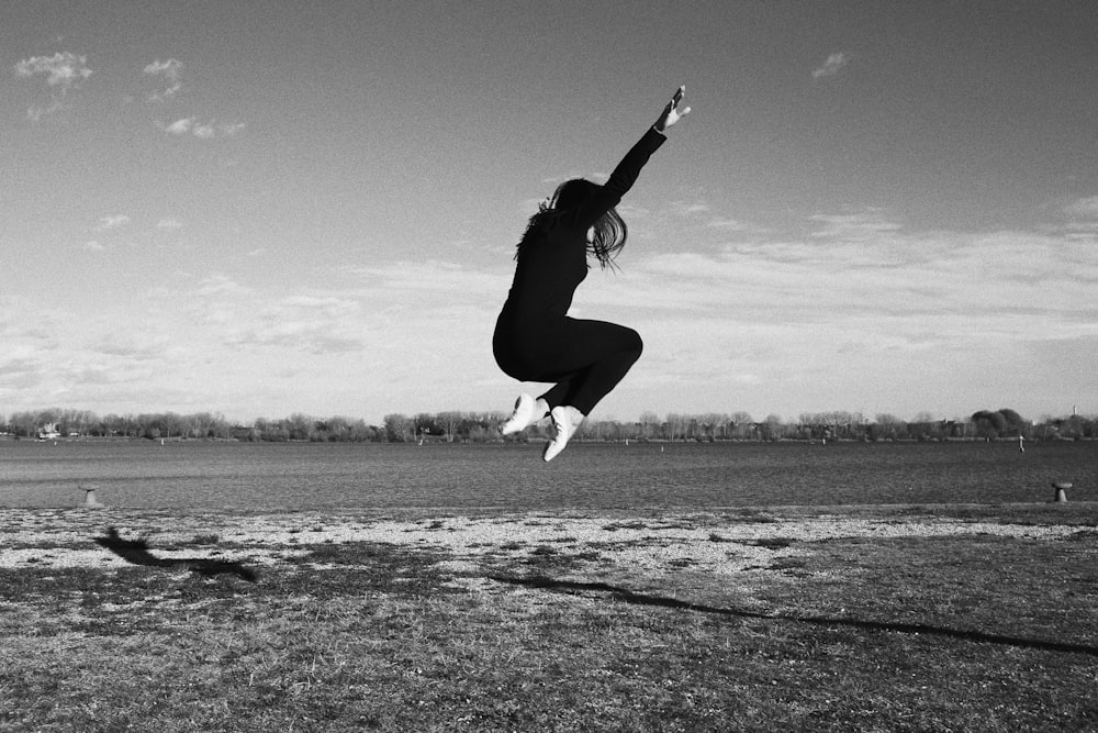 a person jumping in the air with a skateboard