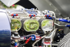 Close-up of a HEPA-filtered vacuum cleaning a car’s interior