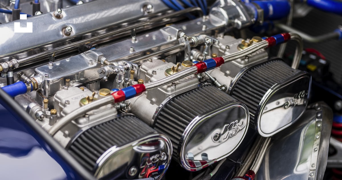 A close up of the engine of a car photo – Free Machine Image on Unsplash