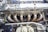 A close-up of precision-engineered automobile components on a workbench.