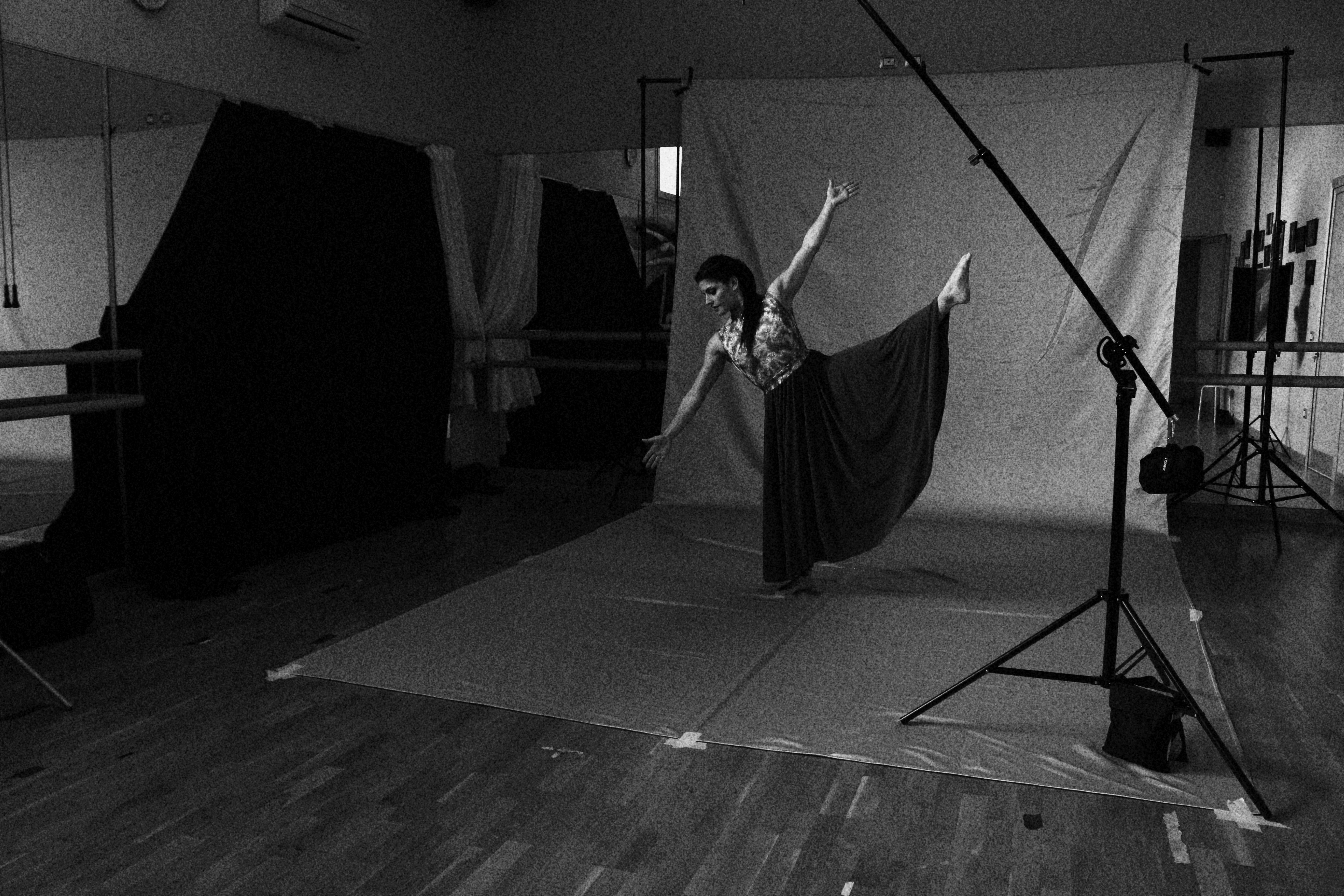 a woman in a black and white photo with a camera