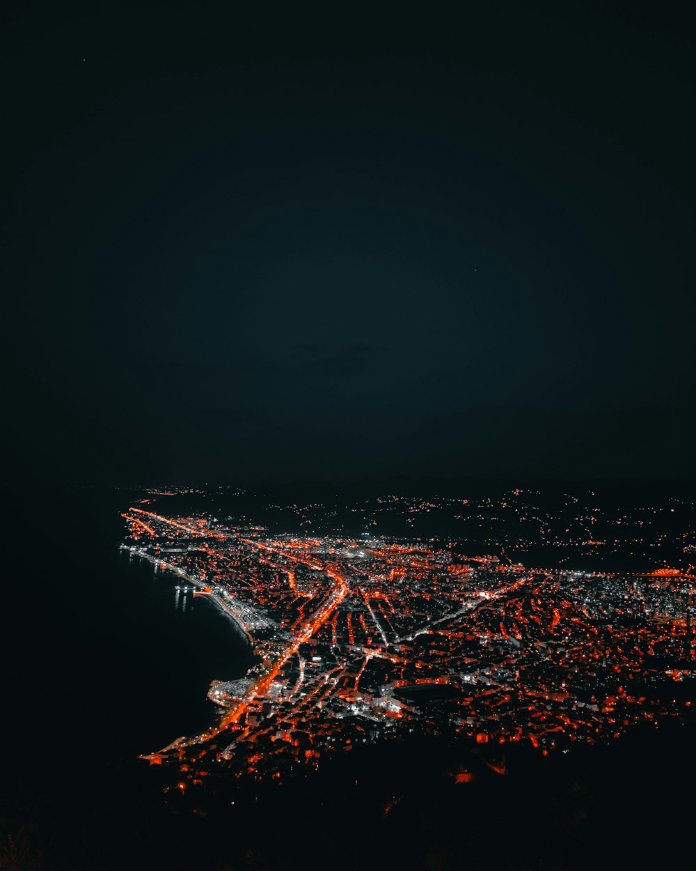 an aerial view of a city at night