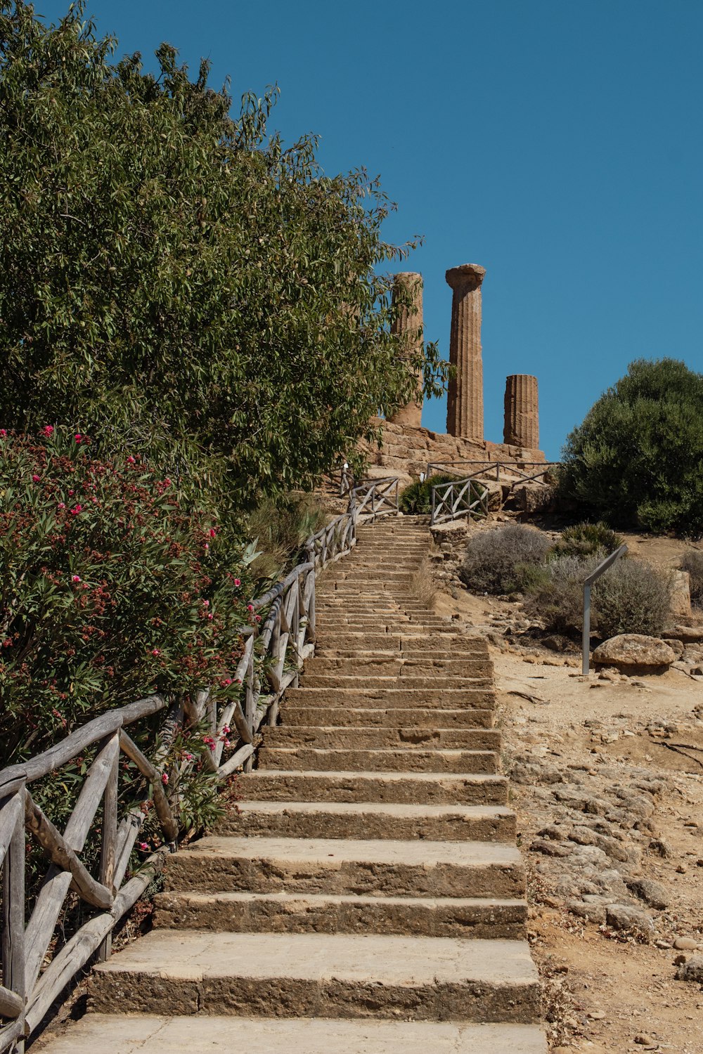 a set of stairs leading up to the top of a hill