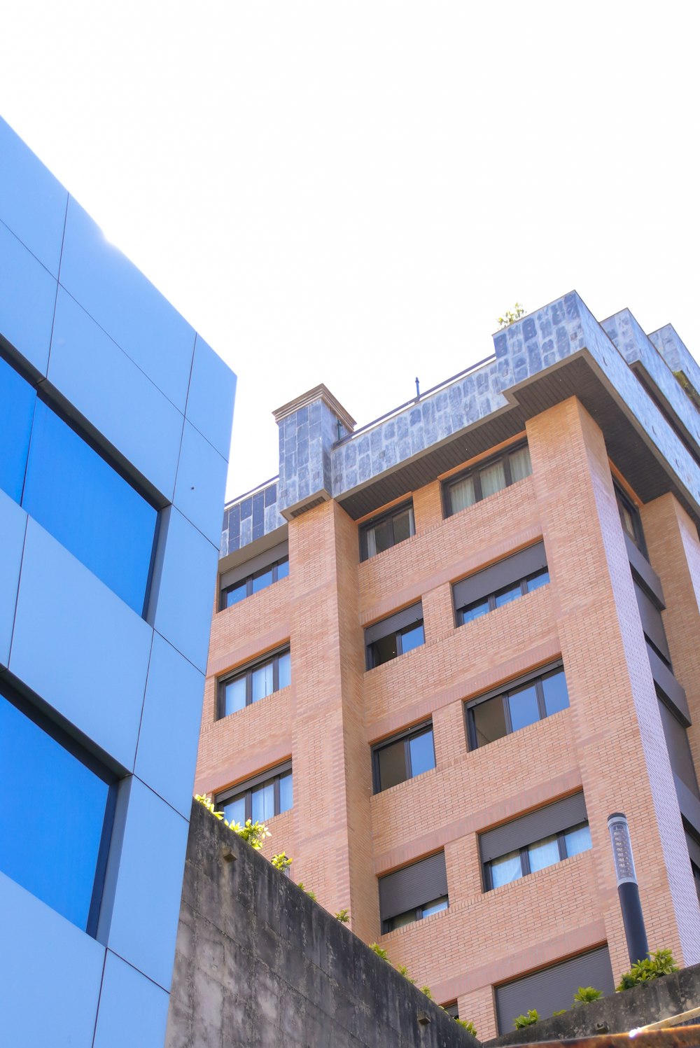 a tall building with a blue sky in the background