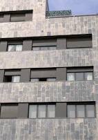 Architectural stone cladding on a contemporary building exterior.