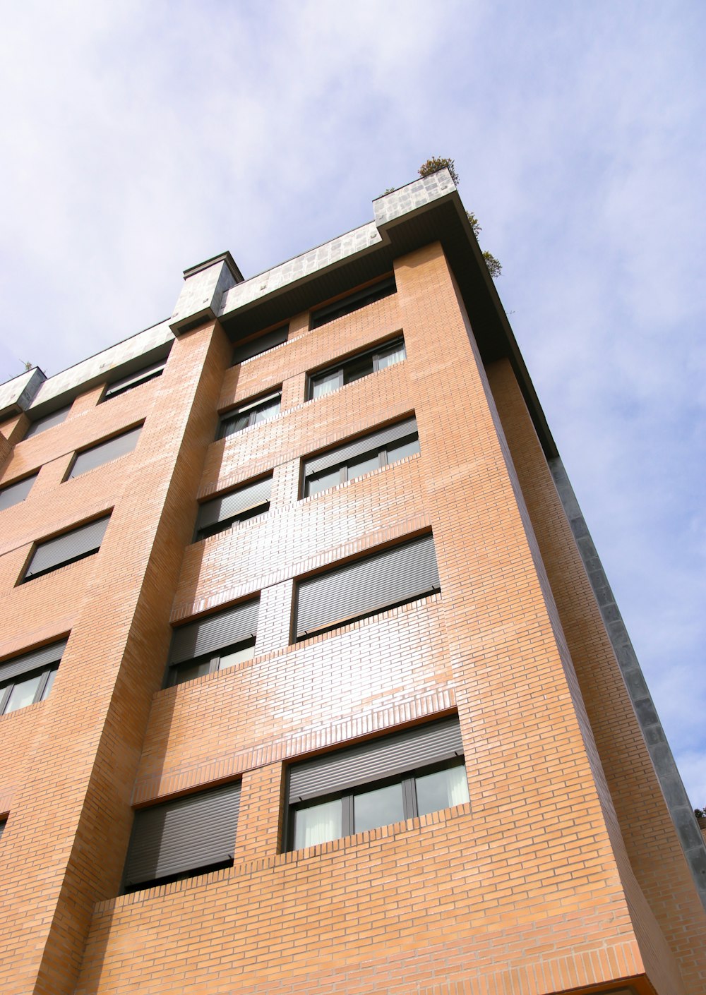 a tall brick building with lots of windows