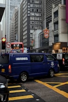 Cash-in-transit armored vehicle driving on an urban street.