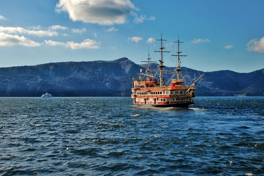 a large boat floating on top of a large body of water