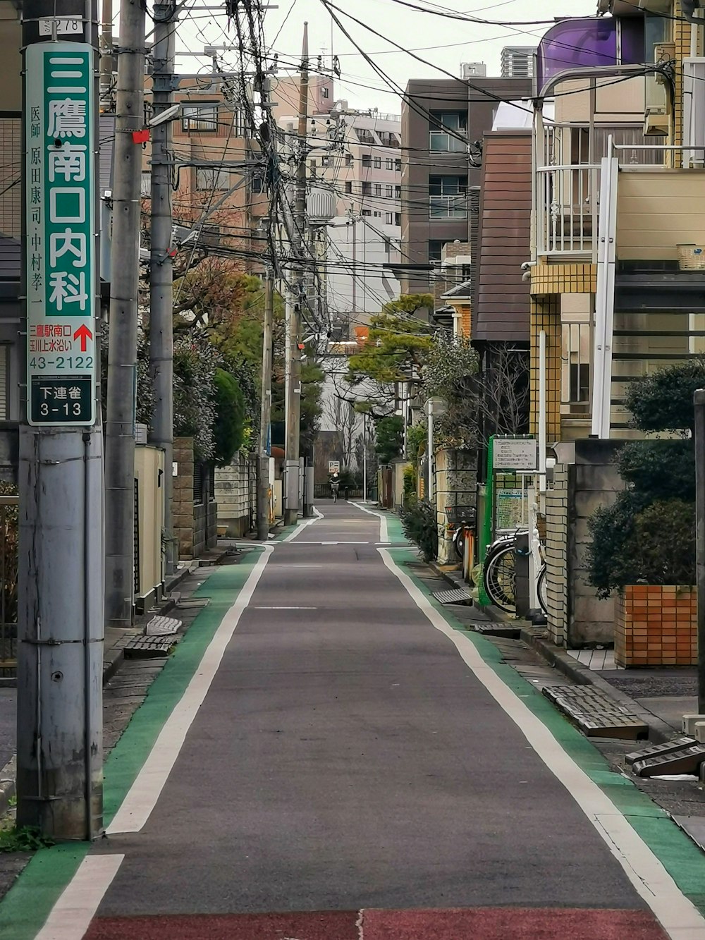 an empty street with a sign on the side of it