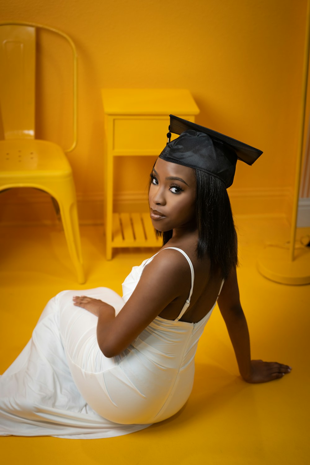 a woman in a graduation cap and gown