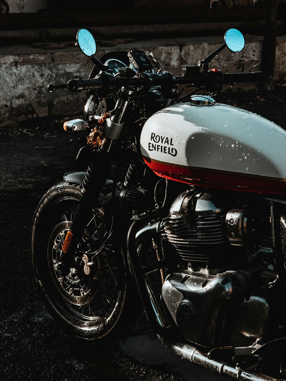 a white and red motorcycle parked in a parking lot