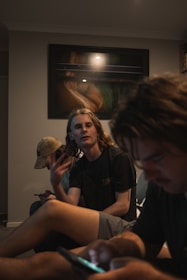 Young people enjoying fast internet on their devices in a cozy home setting.