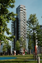 A completed apartment building with happy residents enjoying the outdoor area.