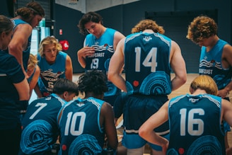 A group of players huddled together, strategizing during a game.