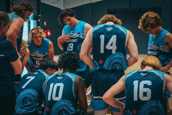 A group of players huddled together, strategizing during a game.