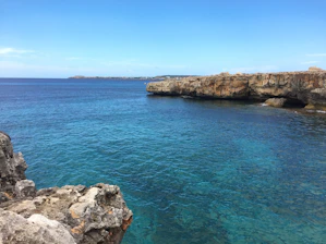 Adventurers exploring a scenic coastal excursion with clear skies.
