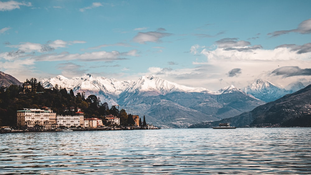 a body of water with mountains in the background