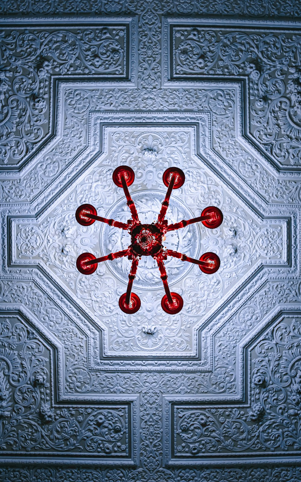 a ceiling in a building with a circular design on it