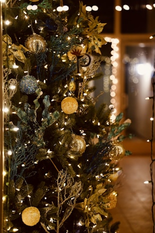 A cozy Christmas scene with twinkling lights and a decorated tree.