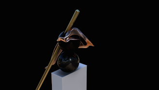 A contemporary art piece displayed on a pedestal.