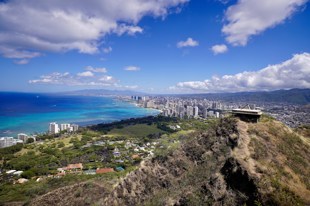 a scenic view of a city and the ocean