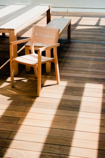 two chairs and a table on a wooden deck