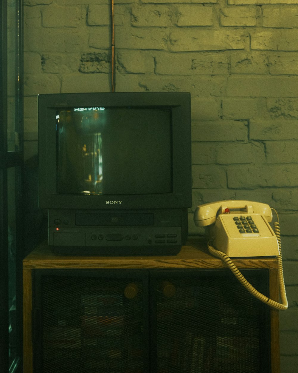 a television sitting on top of a wooden table