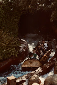 Family laughing together while enjoying a thrilling water ride at a luxurious water park.