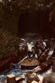 A group of people enjoying a water park ride.