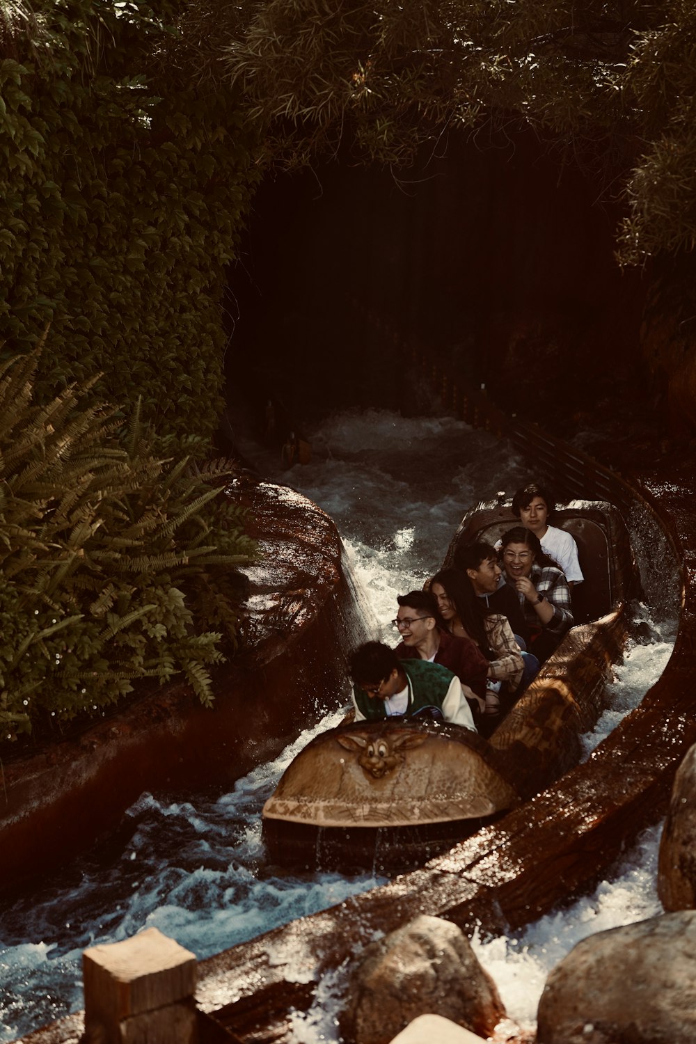 a group of people riding a raft down a river