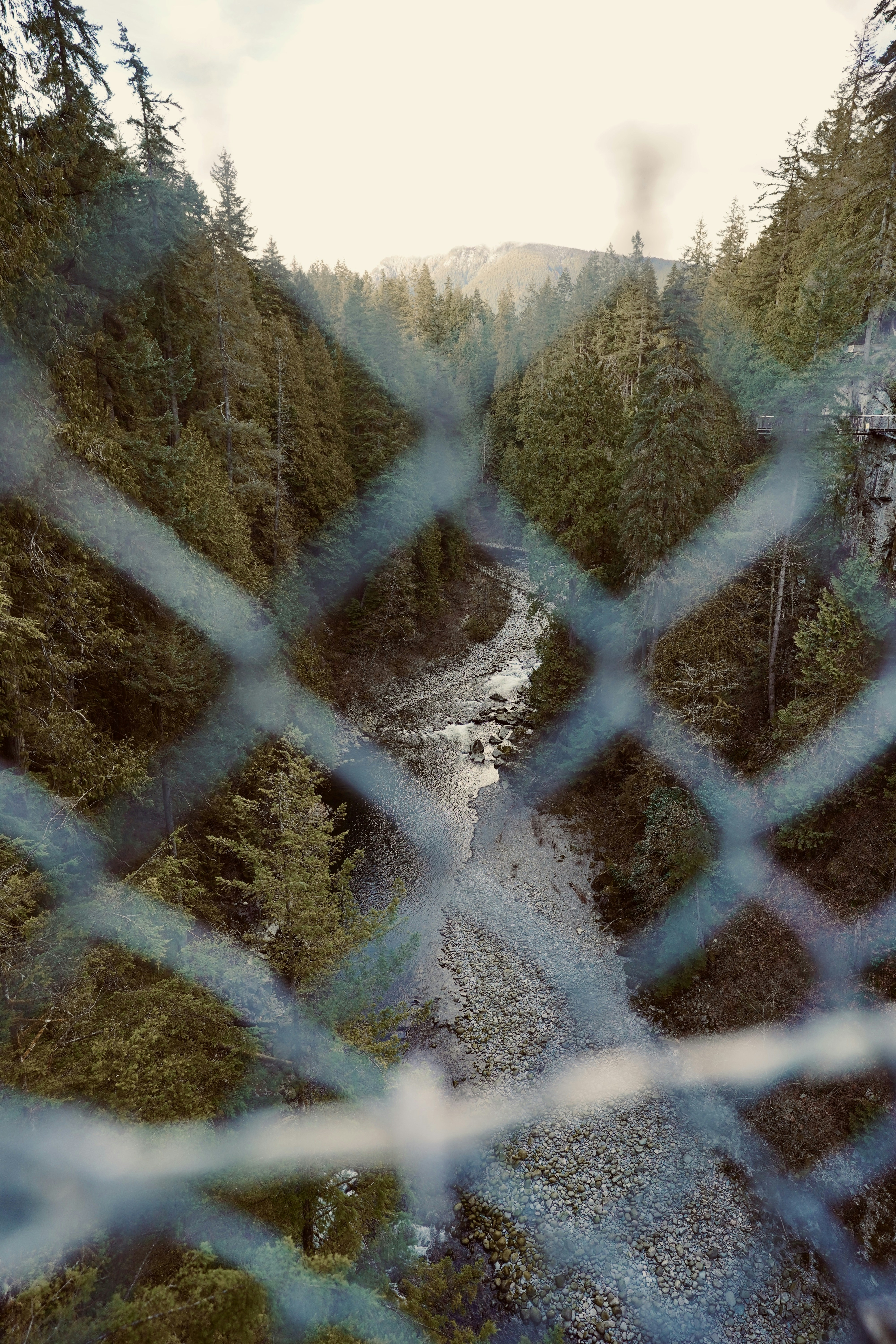 A view of a river through a chain link fence photo – Free Canada Image on  Unsplash