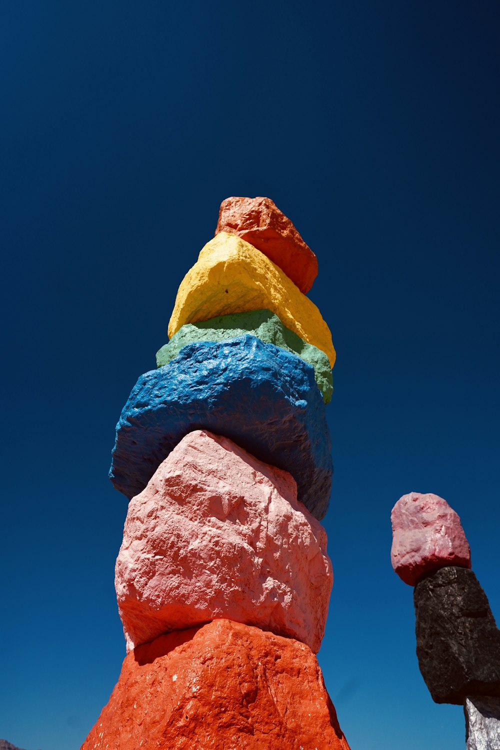 a tall stack of rocks sitting on top of a beach