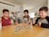 A happy family playing a board game together.