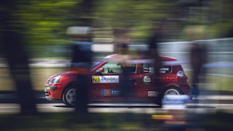 A dynamic image of a race car speeding on a track, emphasizing speed and precision.
