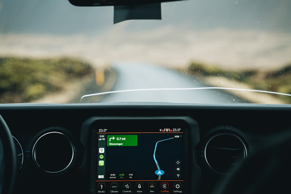 the dashboard of a car with a gps device