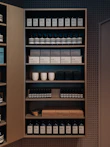 Selection of personal care products like lotions and soaps displayed on a modern shelf