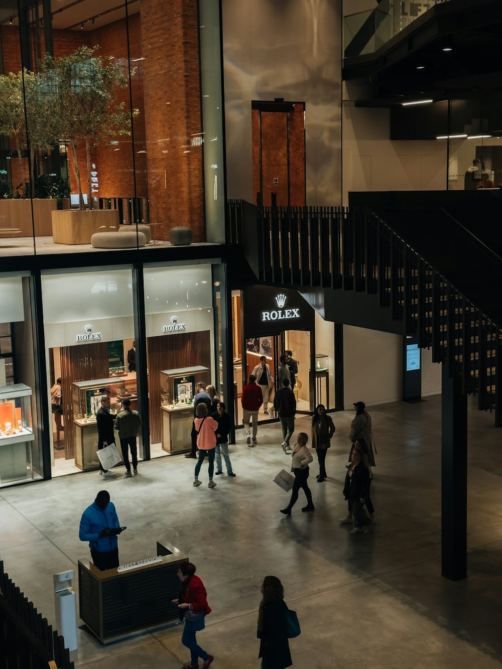 a group of people walking around a building