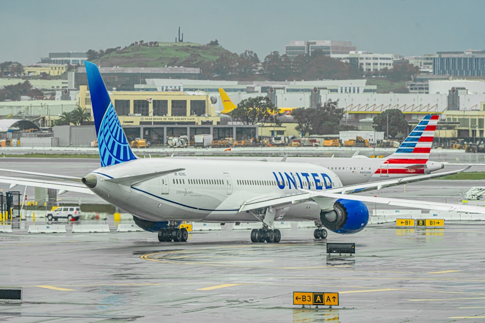 a large jetliner sitting on top of an airport tarmac