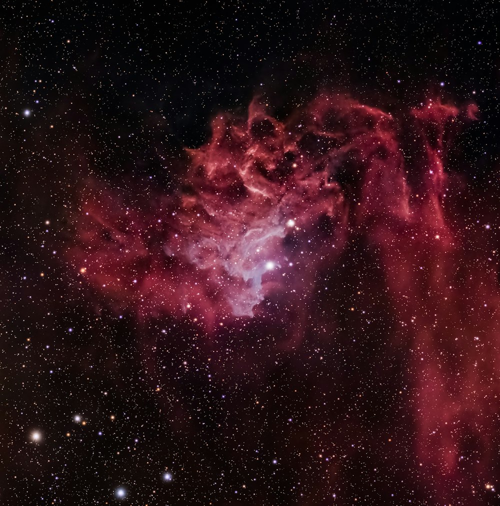 a large star cluster in the middle of a night sky