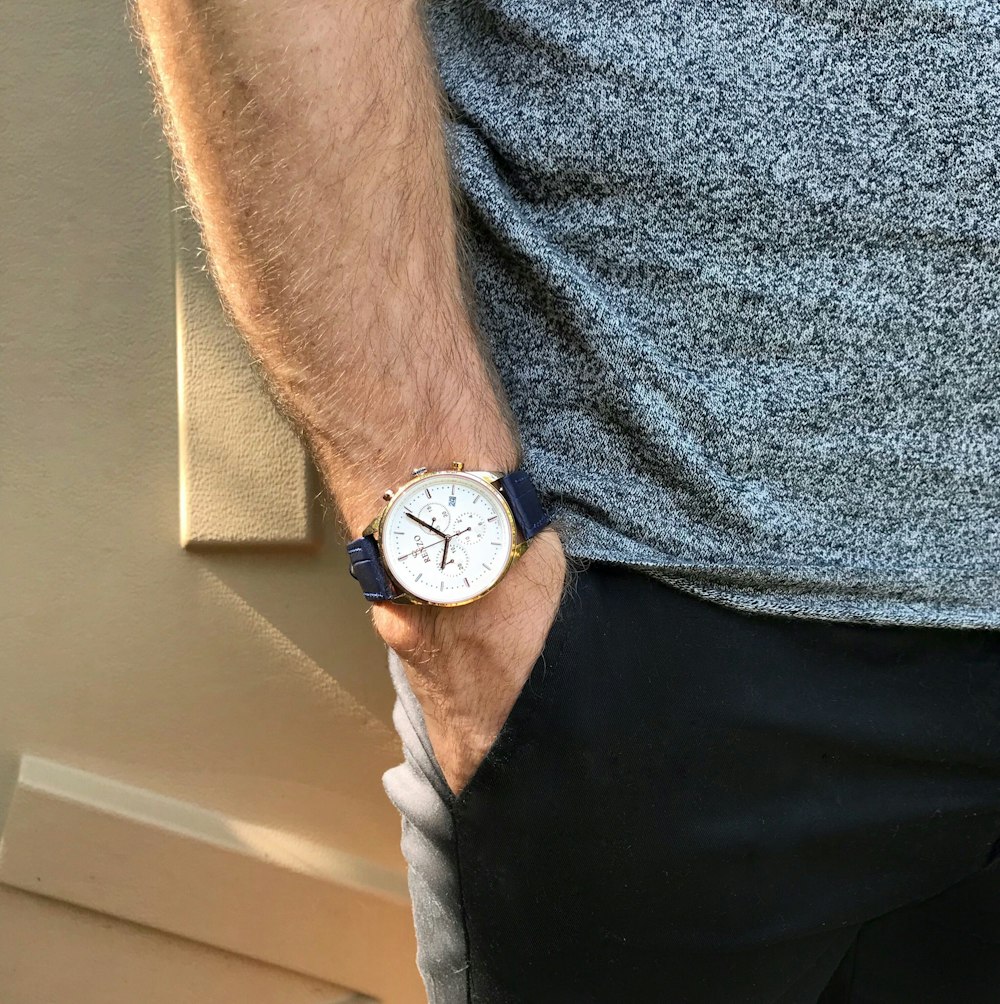 a man with a watch on his wrist
