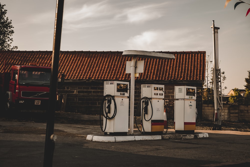 a couple of gas pumps sitting in front of a building