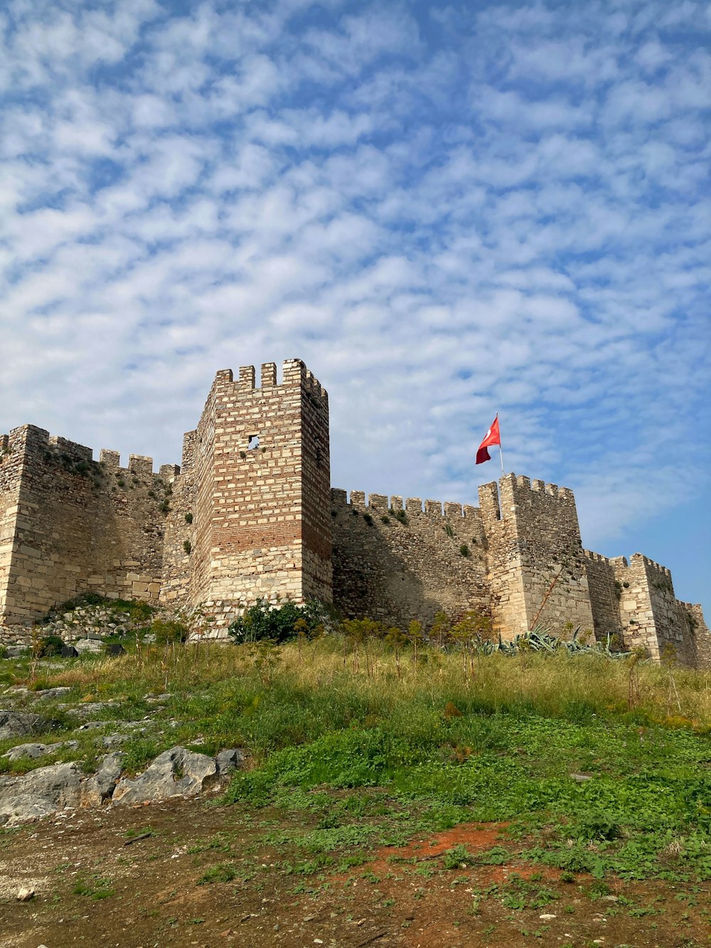 a castle with a flag on top of it