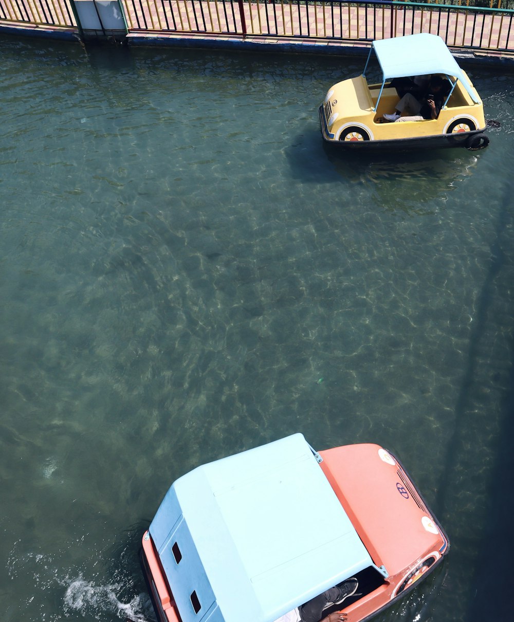 two small boats in a body of water