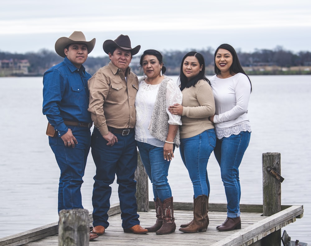 a group of people standing on a dock