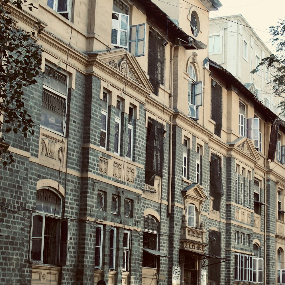 a row of old brick buildings on a city street