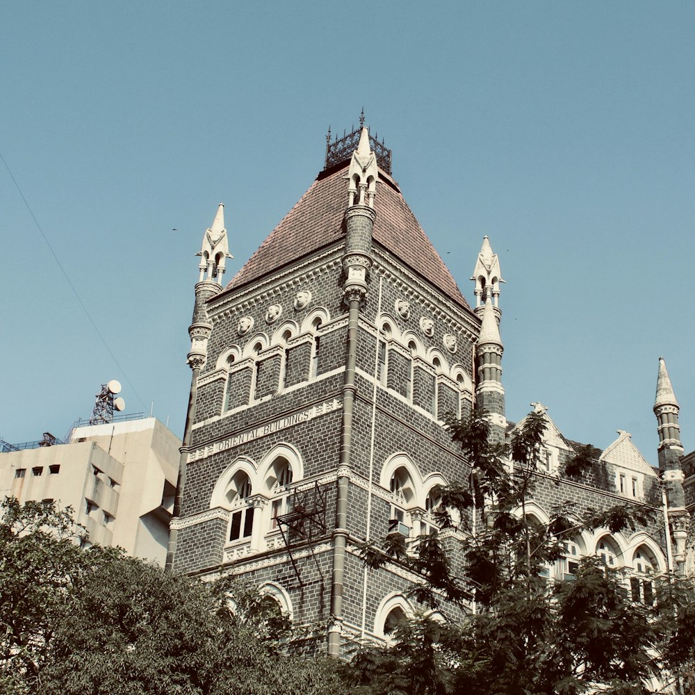 a tall building with a clock on the top of it